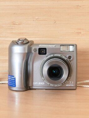 OLYMPUS SP-310 7.1MP Digital Camera, 3x Optical Zoom, Silver